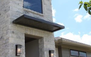 Metallic Products' personnel door canopy on a home in Trendmaker Homes' Bridgeland community