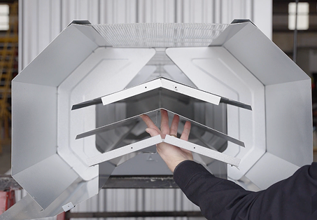 Man showing metal building continuous ridge vent