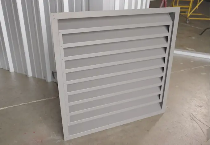 Gray fixed louver at Metallic Products' steel building accessory manufacturing facility